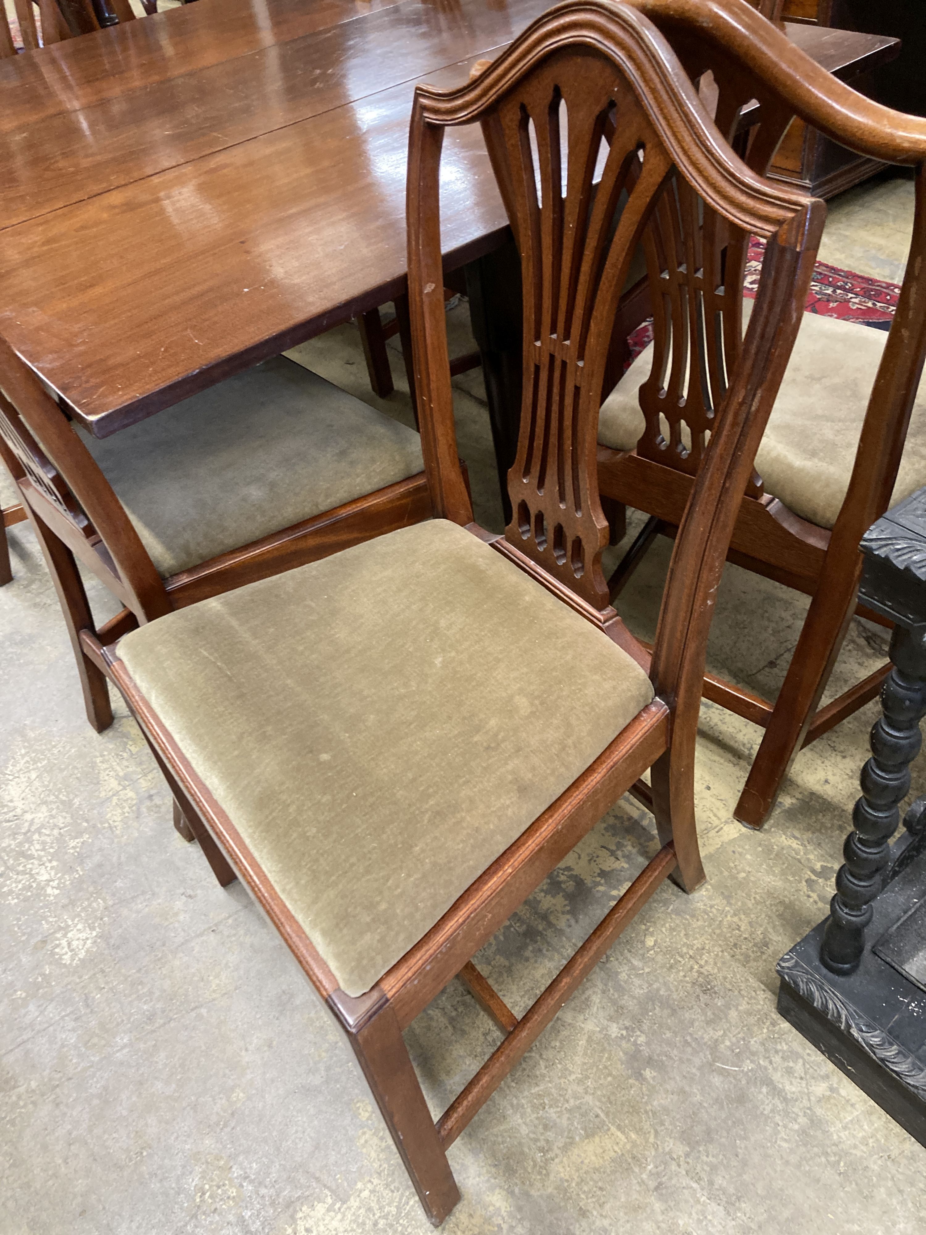 A set of eight Hepplewhite style mahogany pierced slat back dining chairs